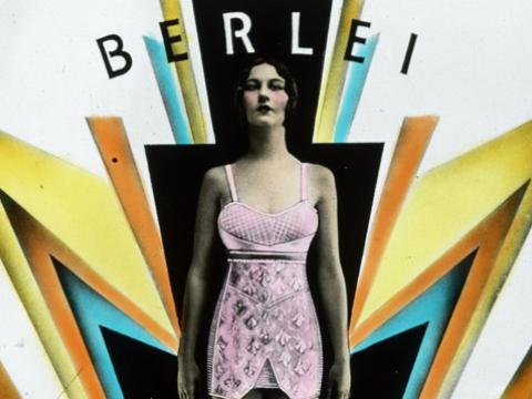 A woman wearing a pink foundation garment stands amidst art deco design elements suggesting clouds and lightening. The text reads 'side fastening wrap-on [corset] for medium average figures'.