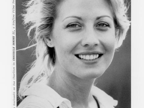 Black and white production still of Sue Charlton (Linda Kozlowski)