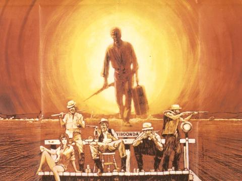 Detail from a 1971 Australian poster featuring four men and a woman on a railway platform and John Grant carrying a suitcase and gun, silhouetted against a blazing sun