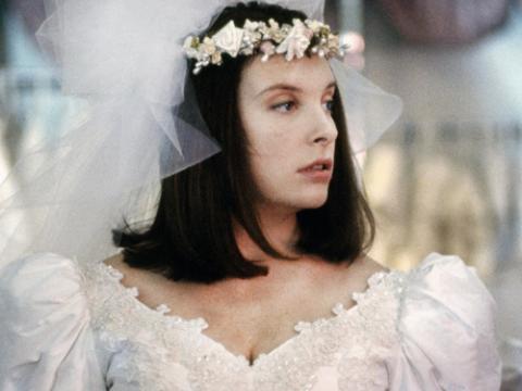 Toni Collette as Muriel trying on a wedding dress.