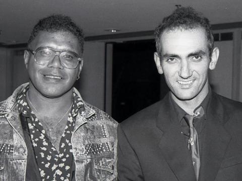 A black and white photograph of Archie Roach and Paul Kelly.