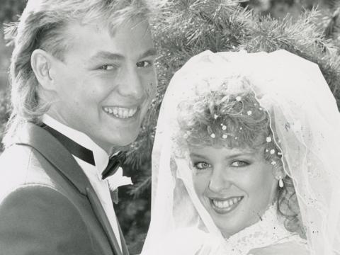 A close-up of Jason Donovan and Kylie Minogue as Scott and Charlene on their wedding day in Neighbours.
