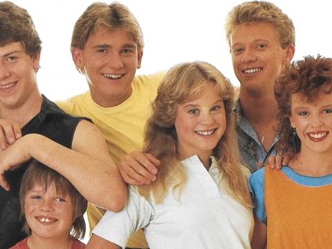Instantly recognisable for her big smile, a young Kylie Minogue appears far right in this cast photograph of The Henderson Kids. Other cast includes (clockwise): Ben Mendelsohn, Paul Smith, Mark Hennessy, Nadine Garner and Bradley Kilpatrick.