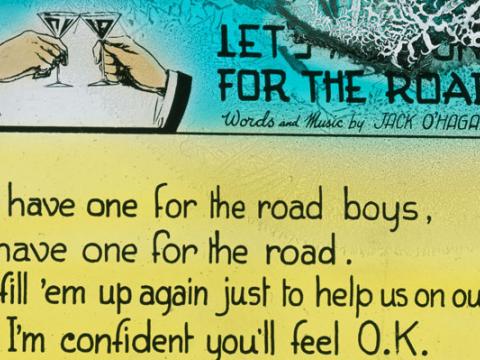 Close-up of a glass slides with the words for 'Let's Have One for the Road' by Jack O'Hagan.