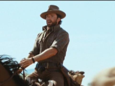 Hugh Jackman as The Drover on horseback