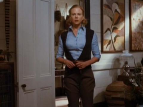 Full-length shot of Lady Sarah Ashley (Nicole Kidman) with open collared blue shirt