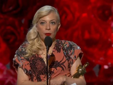 Catherine Martin accepts the Oscar for costume design at the Academy Awards.