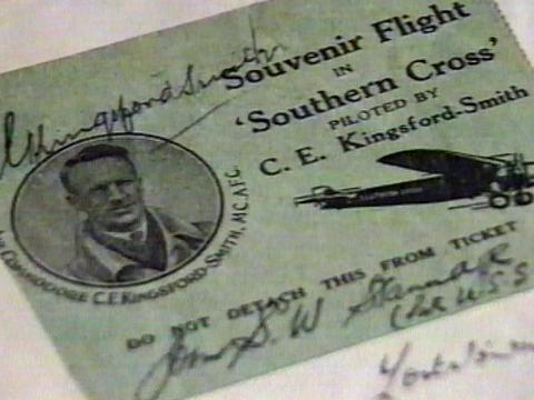 Close up of an old ticket from 1932 for a "Souvenir Flight on 'Southern Cross' Piloted b C.E. Kingsford-Smith. The ticket looks to be signed by the pilot.