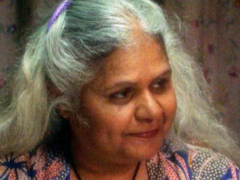 Close up of a grey-haired women looking to her left