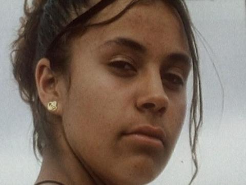 Close up shot of Lena (Jamilla Frail) looking into a car window