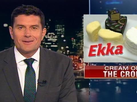 An enthusiastic newsreader introduces a story that says 'Ekka: Cream of the Crop'.
