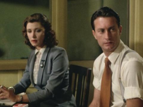 Amy Mackenzie (Wendy Hughes) and film editor Geoff (Bryan Brown) seated 