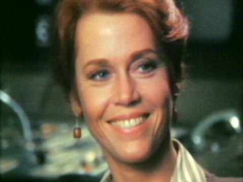 Actress Jane Fonda is smiling. She is in a studio.