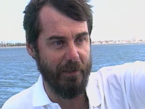 Close up of man involved in the rescue of a whale tangled in netting.