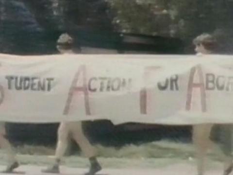 Young people carry a banner that reads 'Student Action For Aborigines'