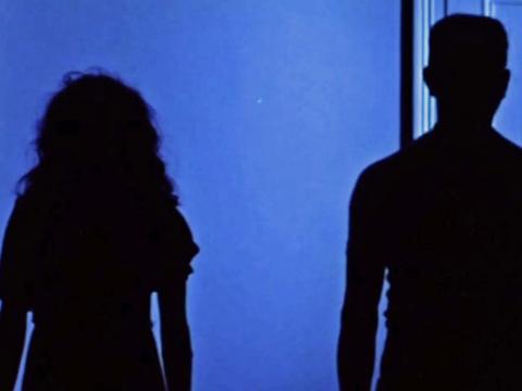 Two spirits stand in shadow