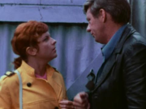 Betty Breen (Bunny Gibson) looking up at Buddy Rand (Fred Cullen)