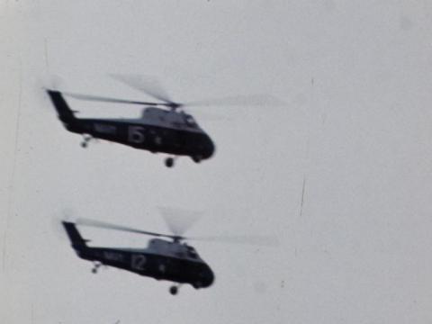 Two helicopters in the sky above Darwin