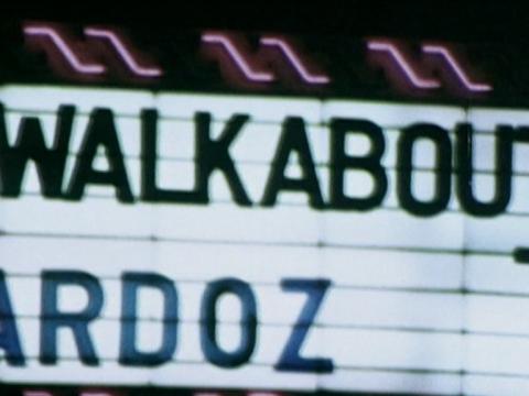 Sign outside a movie theatre showing what is playing including Walkabout and Zardoz