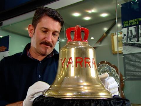Warren Brown handles a bell with the word 'Yarra' on it.