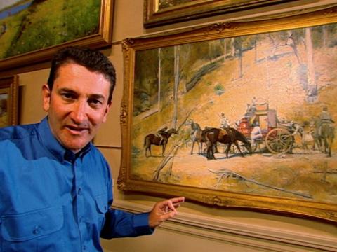 Warren Brown stands next to Tom Roberts' painting 'Bailed Up'.