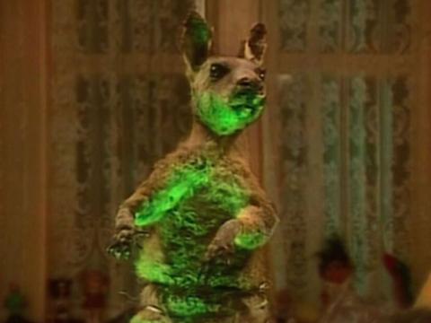 A taxidermied angaroo illuminated by lime green light