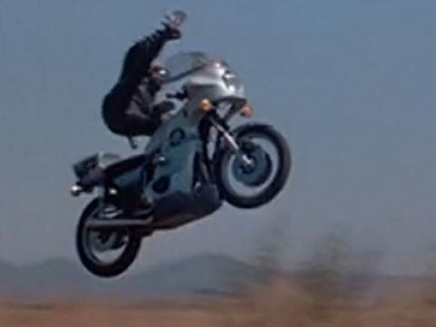 Motorcycle and rider flying through the air.