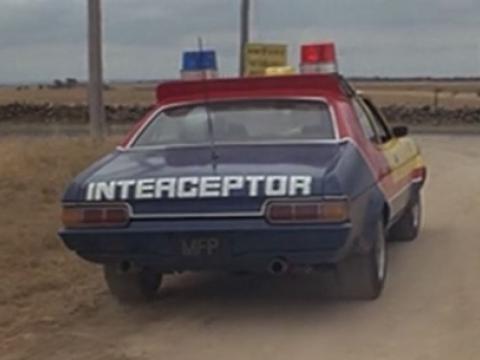 Rear of police car with the word 'Interceptor' across the boot.