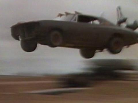 Stunt car flying through the air