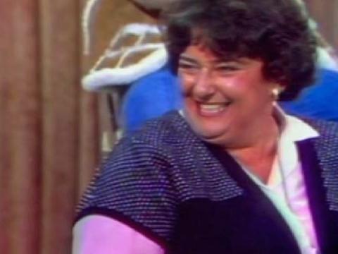 A female Number 96 cast member laughing while being interviewed on The Mike Walsh Show
