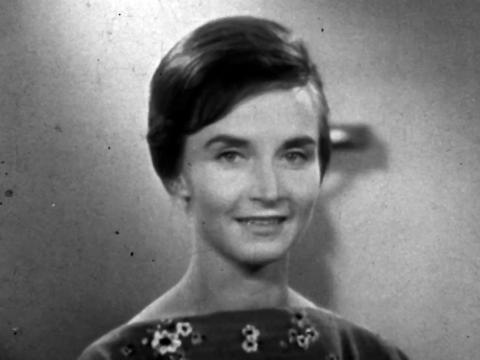 Close up of a young woman looking directly at camera, c1960s.
