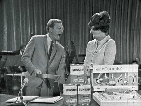 Black and white still of Graham Kennedy and Miffy Marsh in a segment from In Melbourne Tonight
