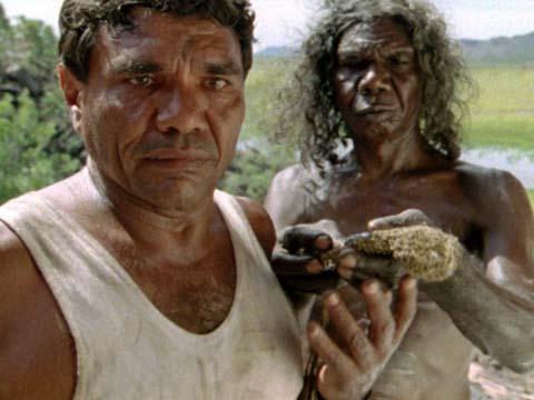Charlie (Tom E Lewis) and Burrimmilla (David Gulpilil) looking in to the sacred site 