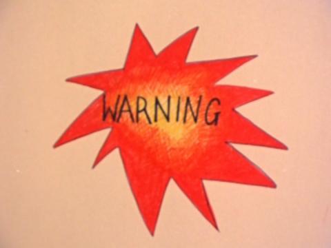 A red starburst with the word WARNING inside it