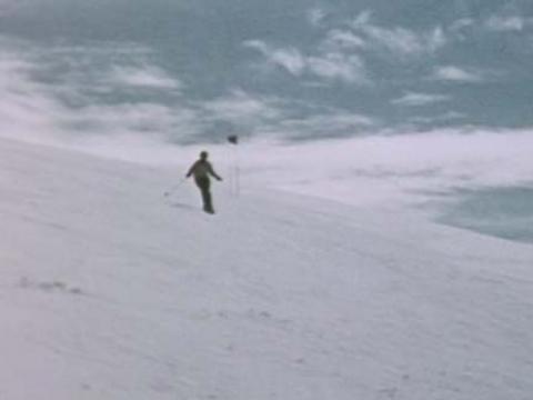 A lone skier on a snowy mountain