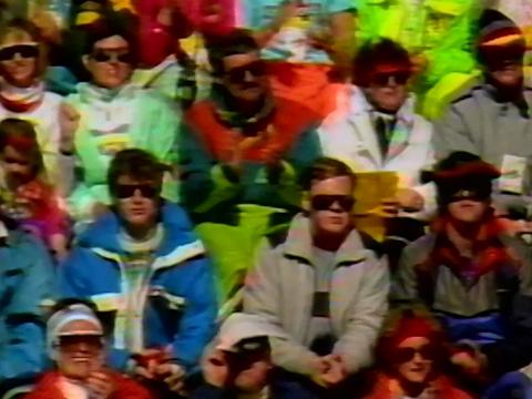 Crowd shot of people wearing colourful jackets