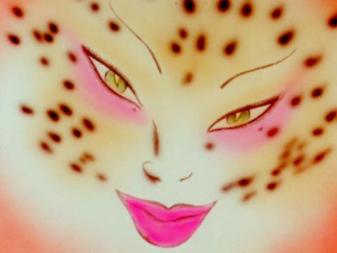 A cartoon face of a cross between a woman and a cat.