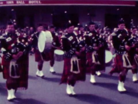 Members of a Scottish marching band performing during an Anzac Day march in 1980