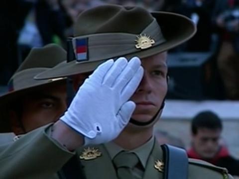 An Australian soldier wearing a slouch hat makes a salute at the Anzac Day centenary commemoration at Anzac Cove