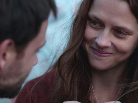 A woman (Teresa Palmer) is looking at a man.