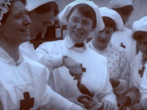 A group of Red Cross nurses laughing while working on the home front during the First World War