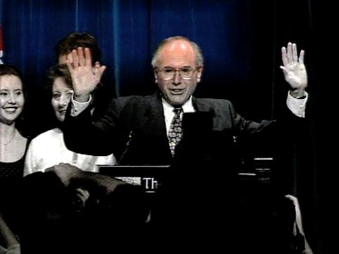 Prime Minister John Howard with hands raised
