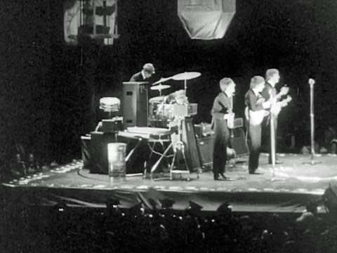 The Beatles performing at Sydney Stadium in 1964.