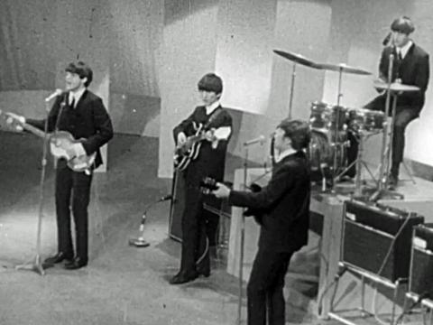 The Beatles performing in a tv studio