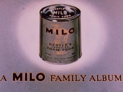 Still showing a milo tin with 'A Milo Family Album' underneath