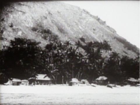 Old black and white image of huts on Murray Island