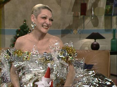 Jeanne Little is dressed in an outfit made out of wrapping paper.