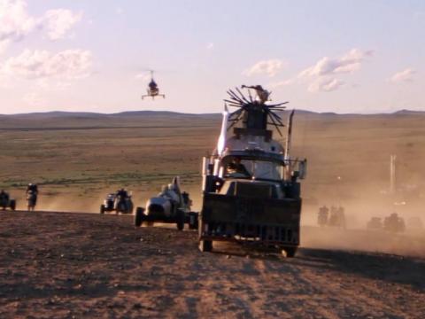 In Mad Max 2, a convoy of trucks, buggies, cars, motorcycles and even a gyrocopter travel across a dusty plain
