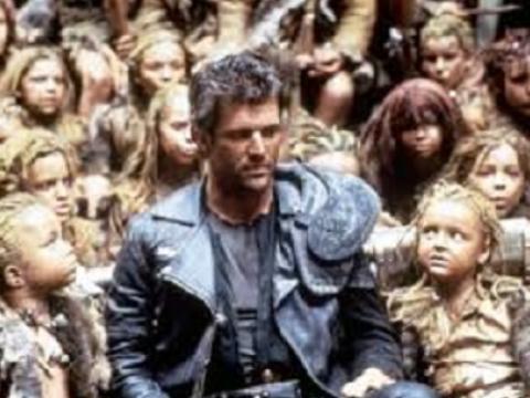 Mel Gibson as Max surrounded by children