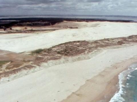 An aerial shot of the beach and sand dunes at Sydney's Wanda Beach, circa 1980.